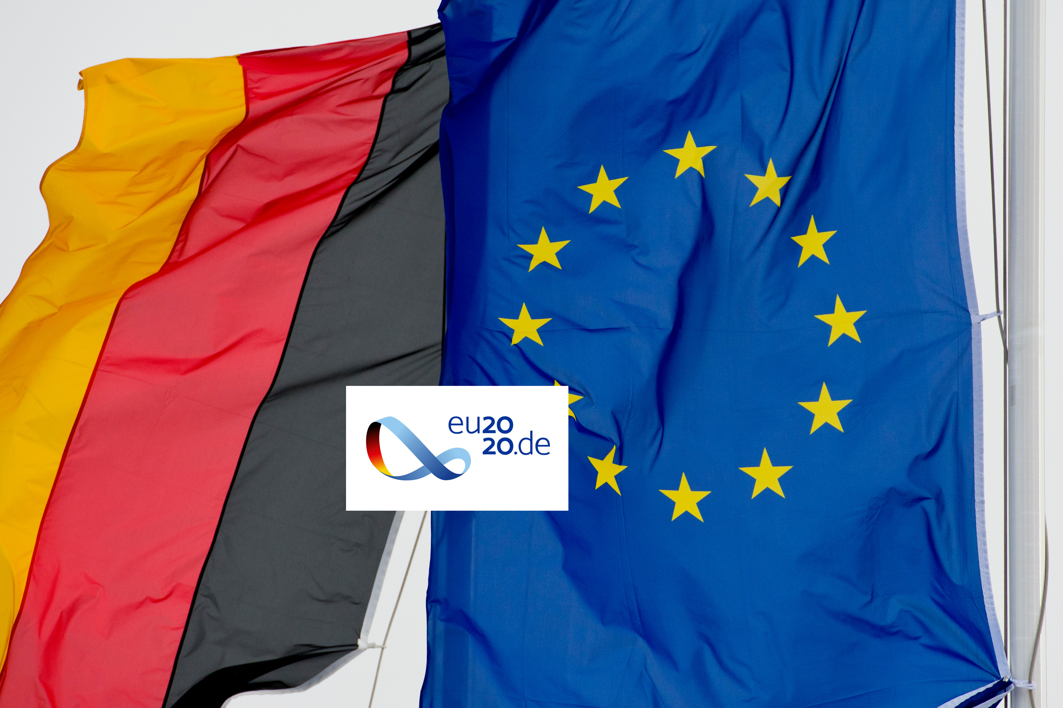 Flag of the Federal Republic of Germany, flag of the European Union and logo of the German EU Council Presidency