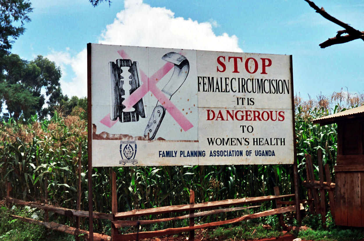 Warning against practising female genital mutilation on a billboard in Uganda