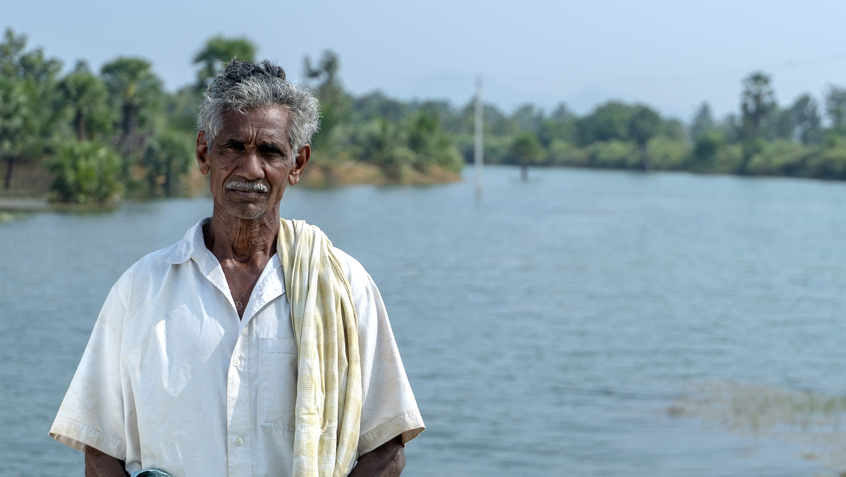 Portraitaufnahme von Herrn Gadanna am Fluss Champavathi