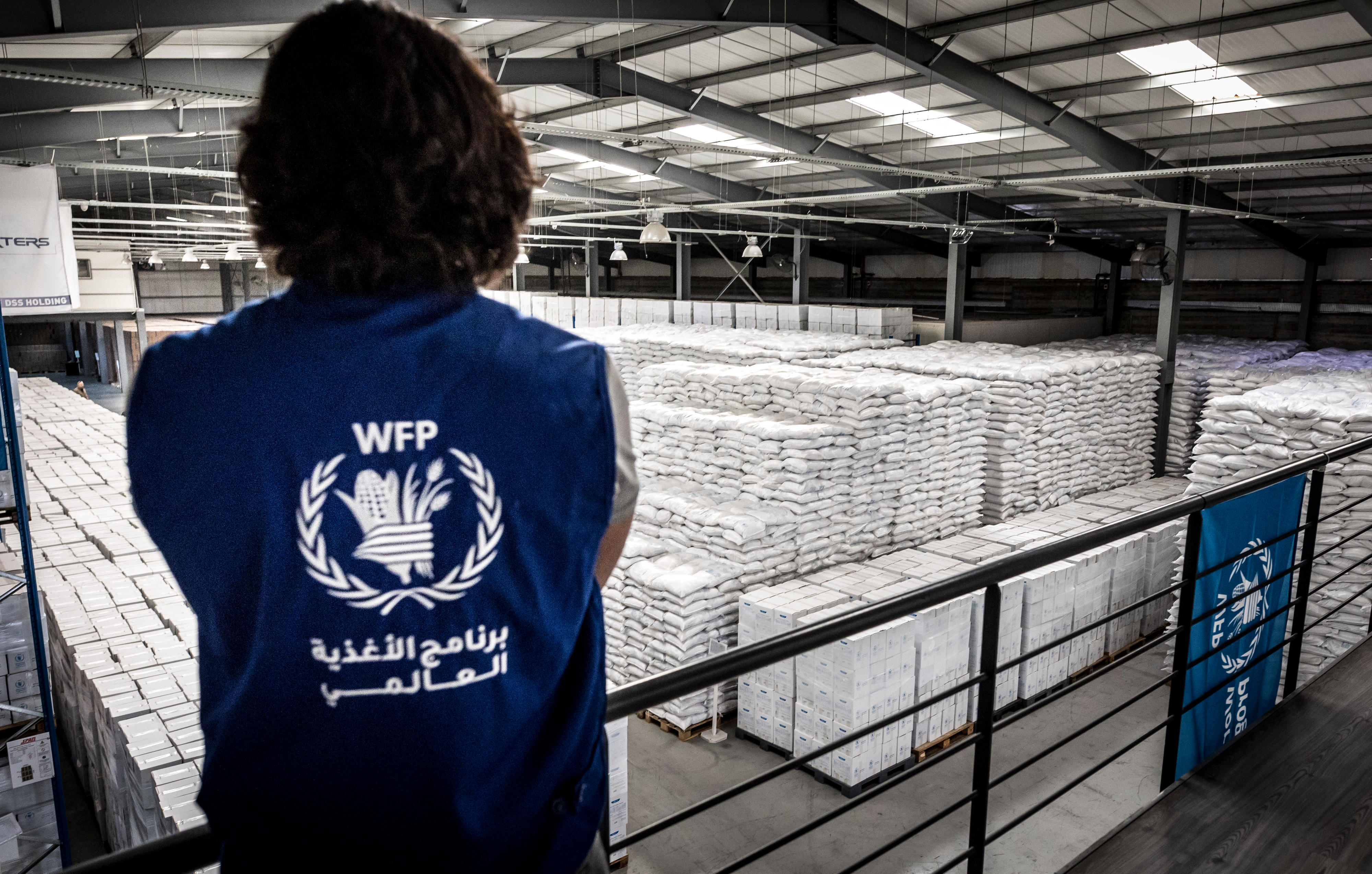 UN World Food Programme (WFP) food warehouse in Beirut, Lebanon: WFP logo on the back of a staff member.