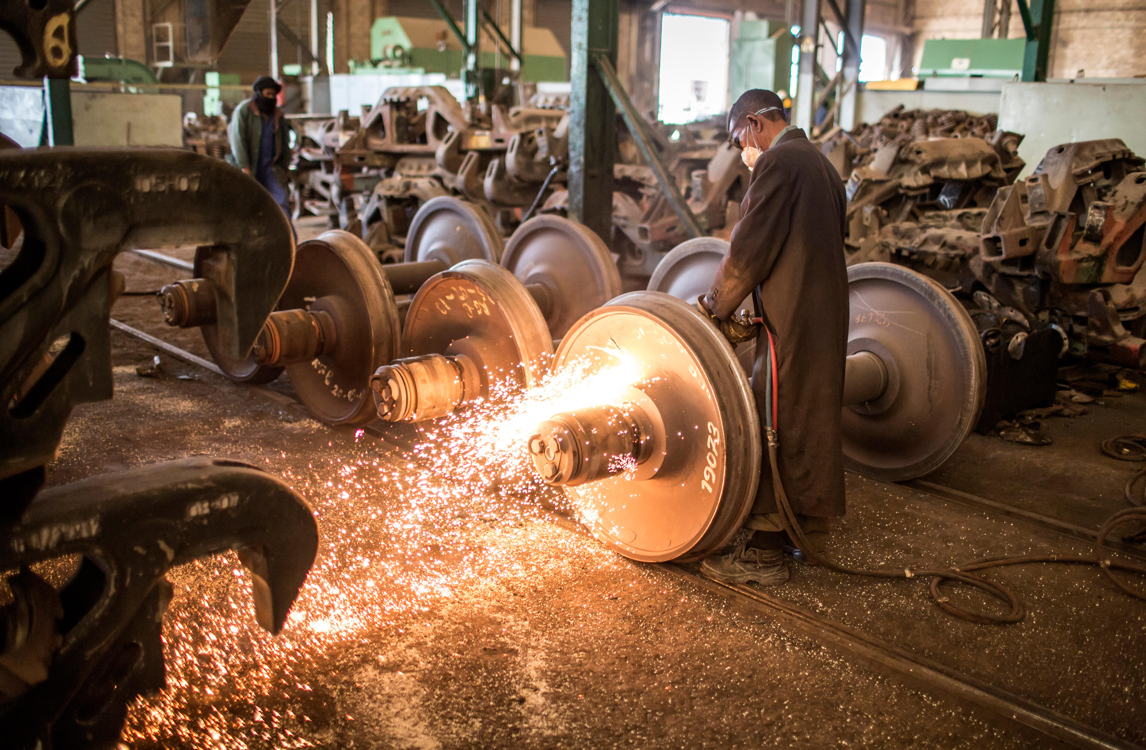 Worker repairing locomotives of an iron ore company in Nouadhibou, Mauritania