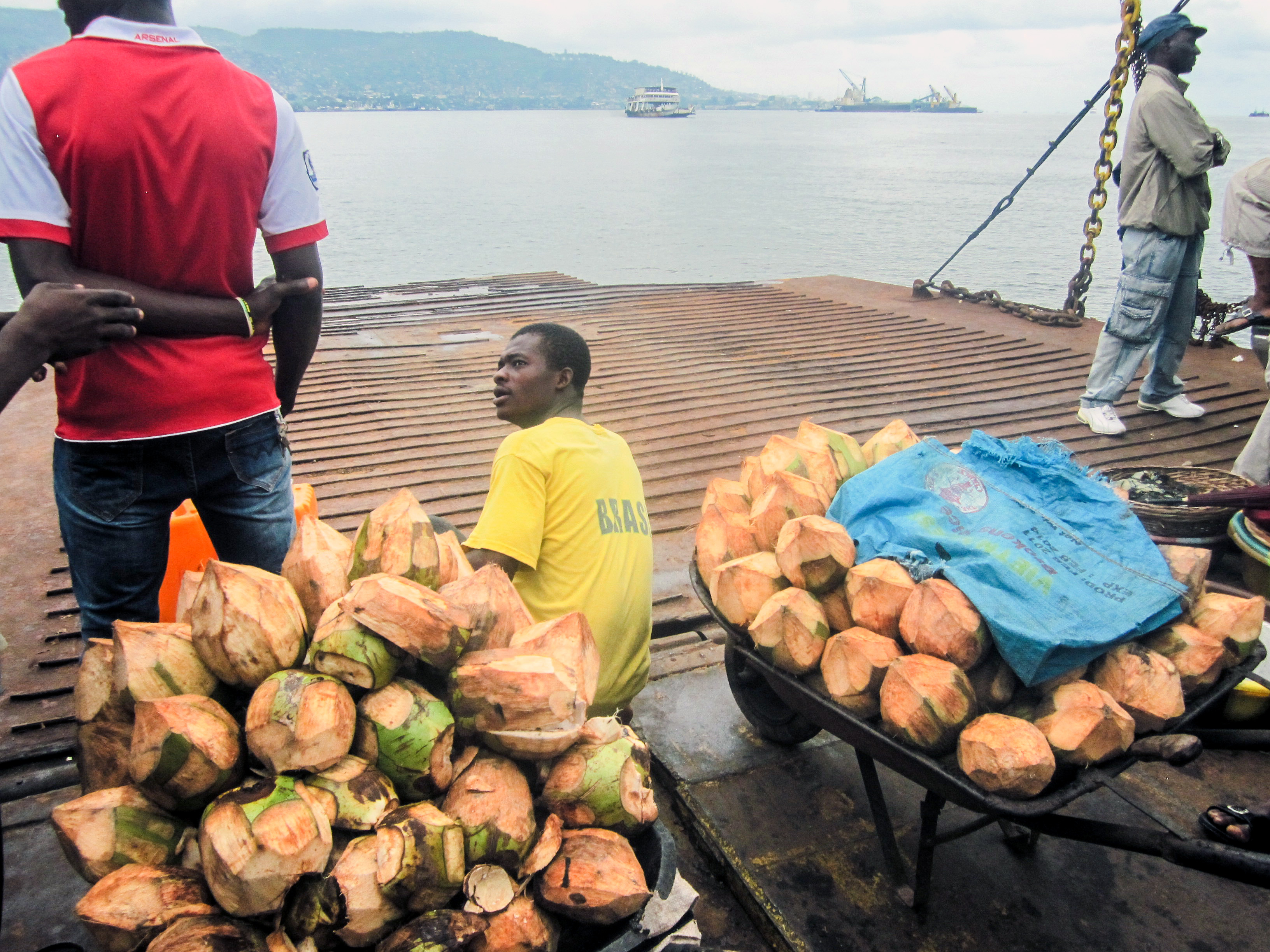 Coconut seller at Lakka Beach ferry terminal