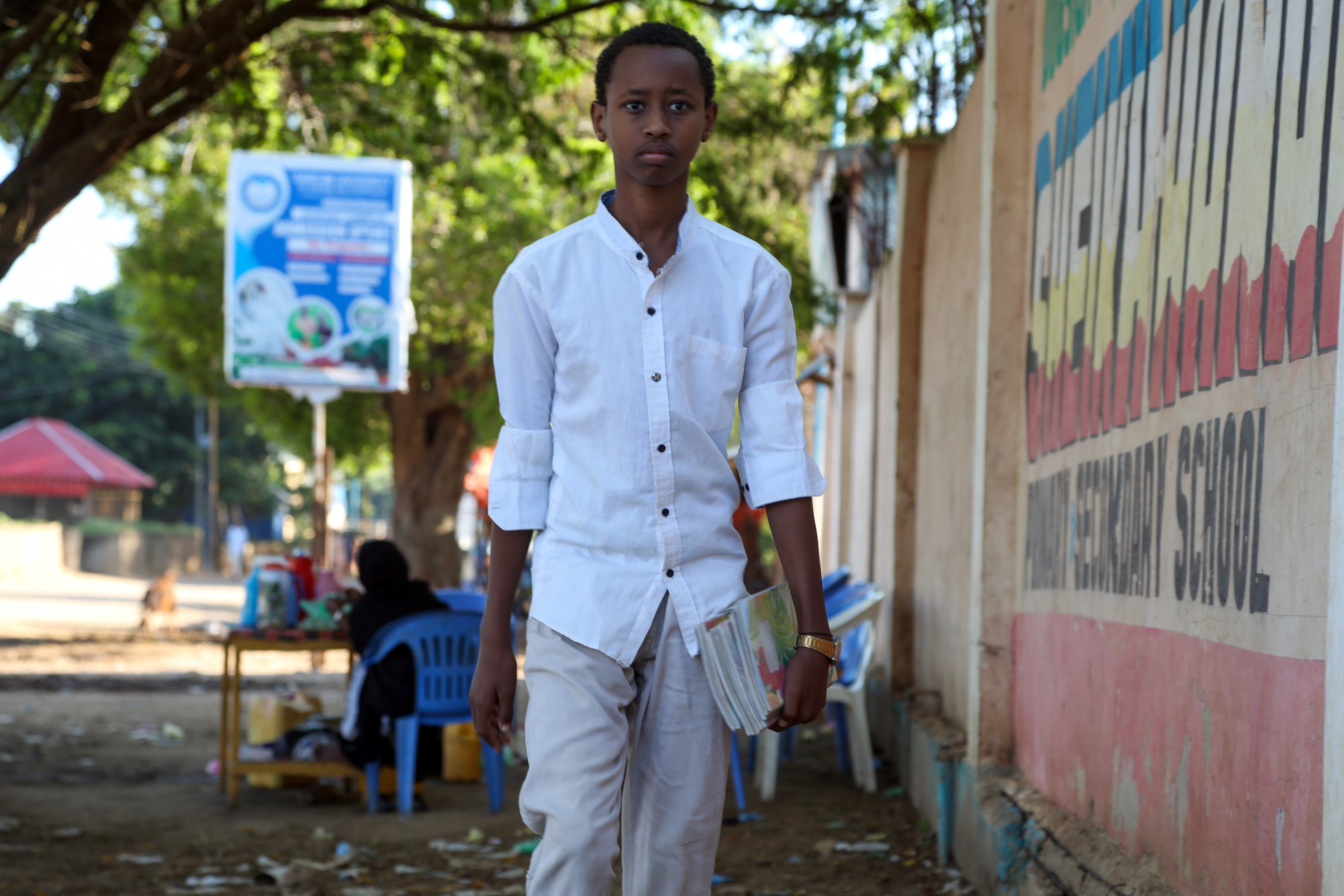 Student with books in Jowhar, Somalia