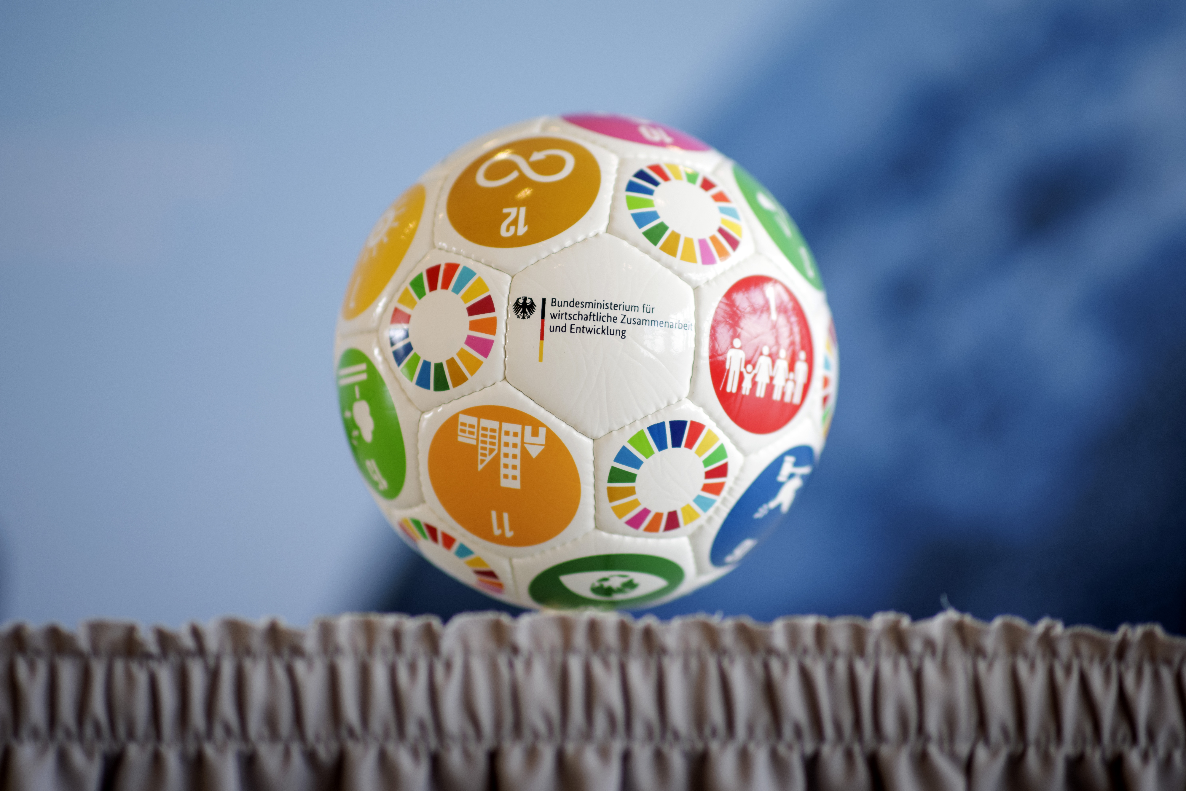 Football with SDG symbols and BMZ logo