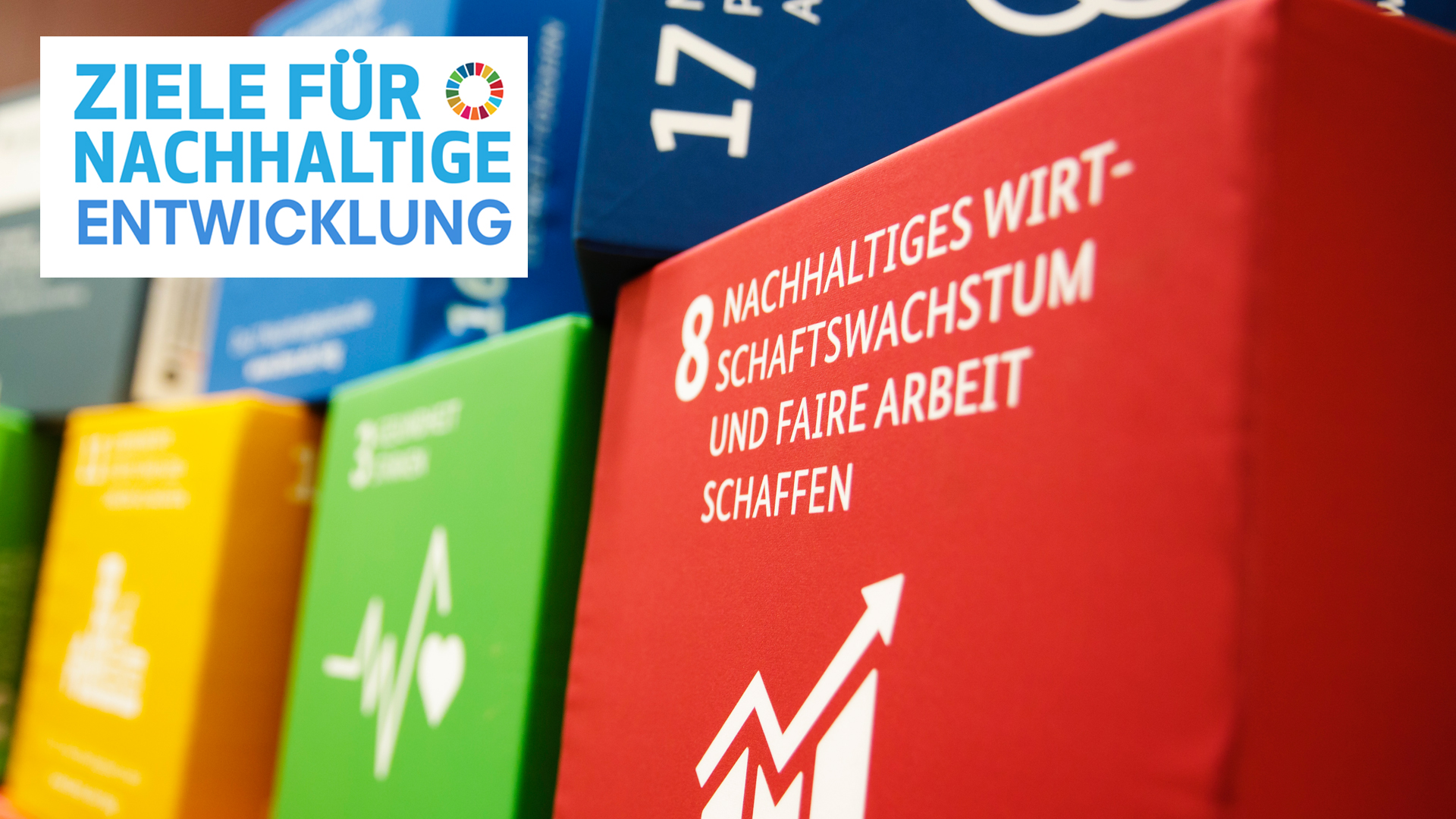 Some of the global development goals as seat cushions at a conference
