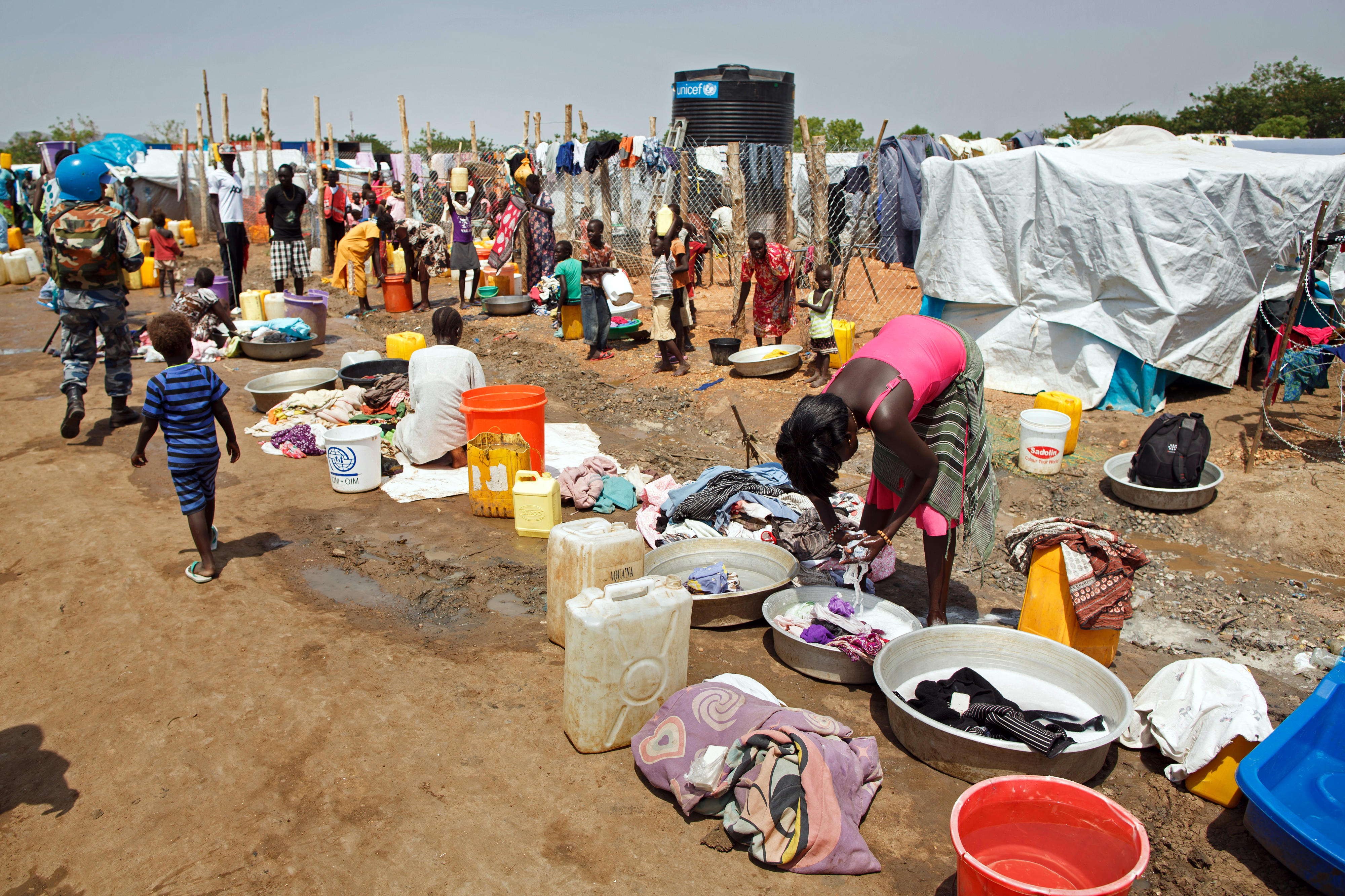 People wash their clothes in an IDP camp in the southern Sudanese capital Juba