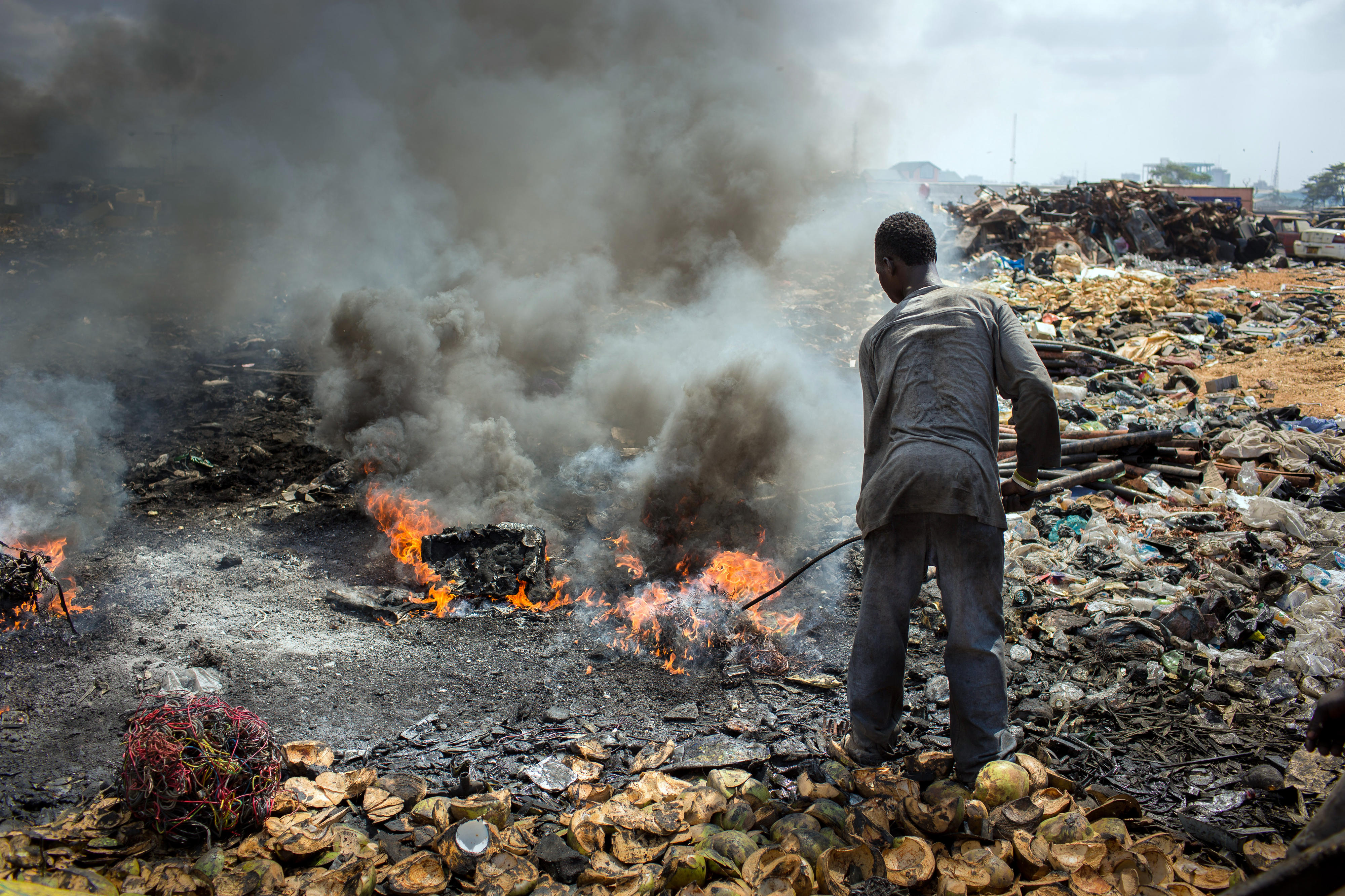 At a landfill site in Ghana's capital Accra, old electrical appliances are incinerated to produce recyclable metal.