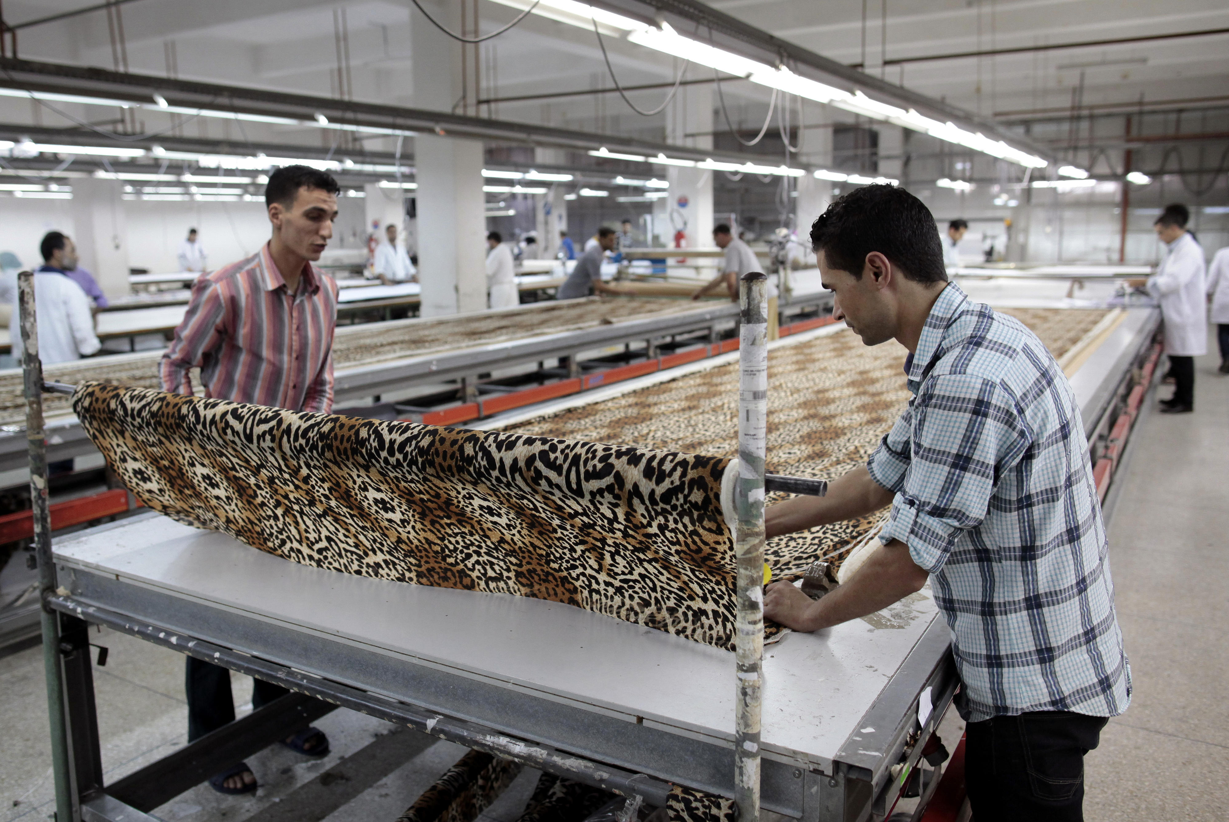 Employee in a textile factory in Morocco, which offers a dual training system based on the German model