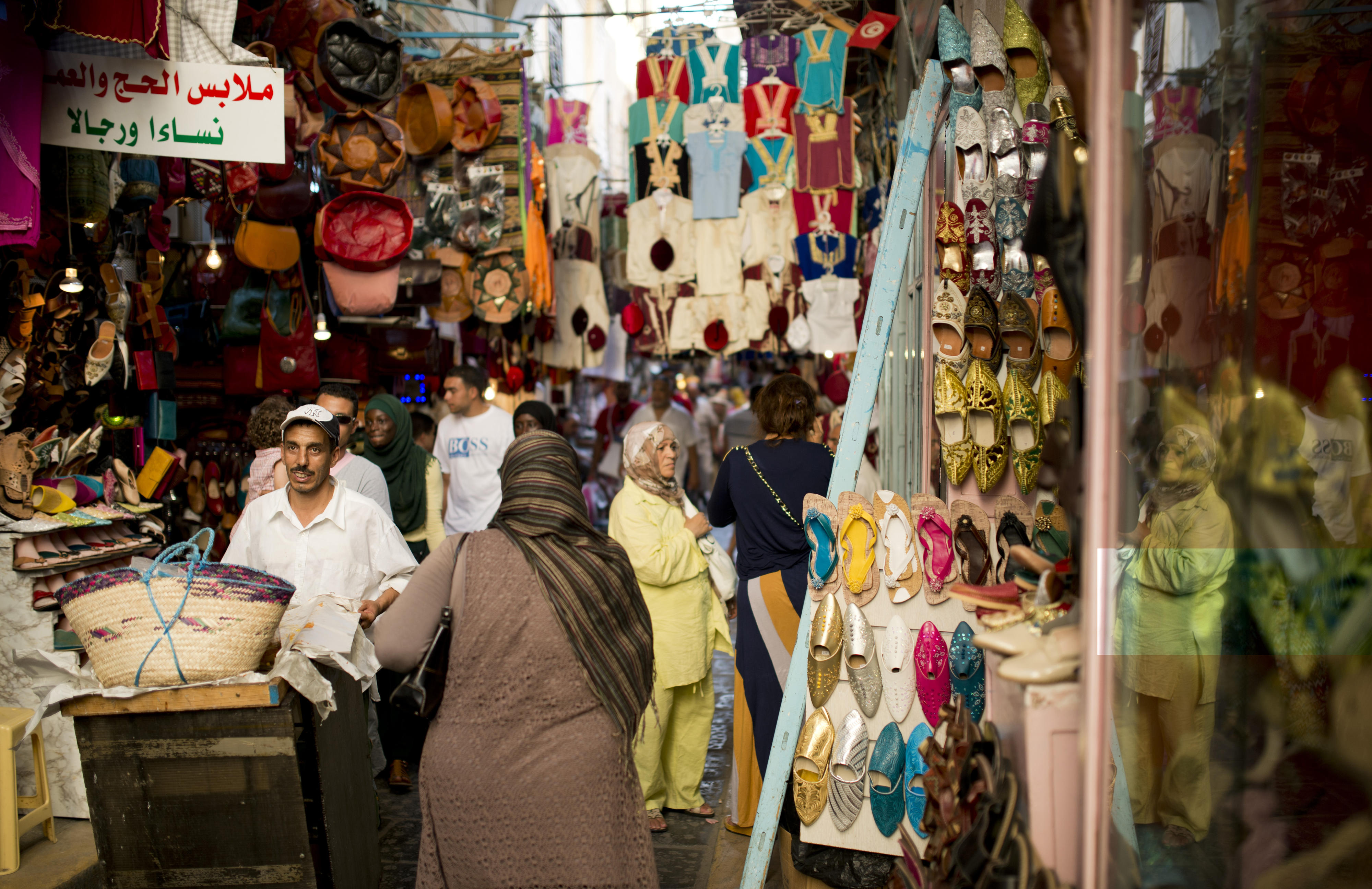 Passers-by in the bazaar of Tunis