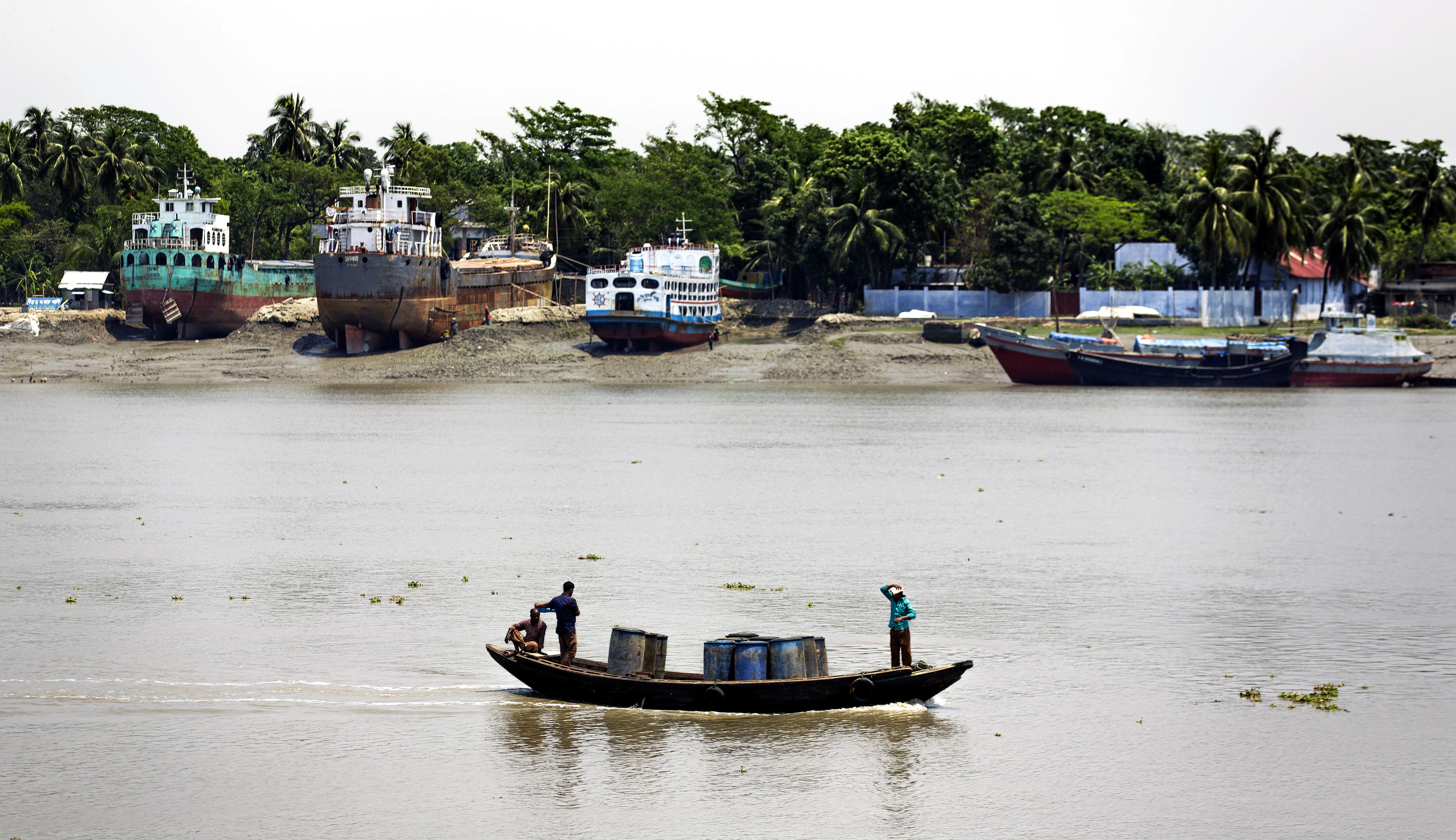 A motorboat driving through the port of Khulna, Bangladesh