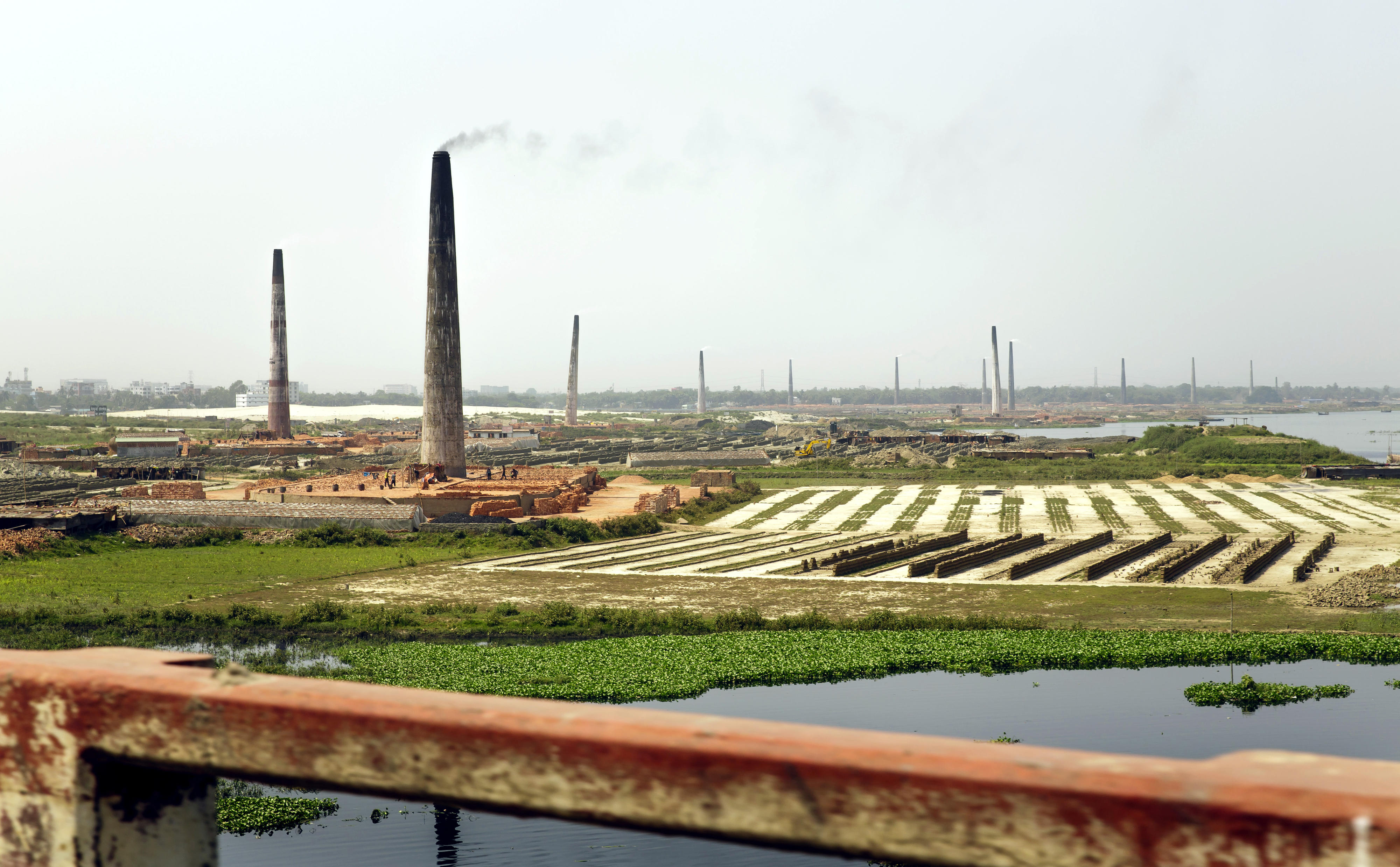 View of the chimneys of brickworks in Savar, Bangladesh