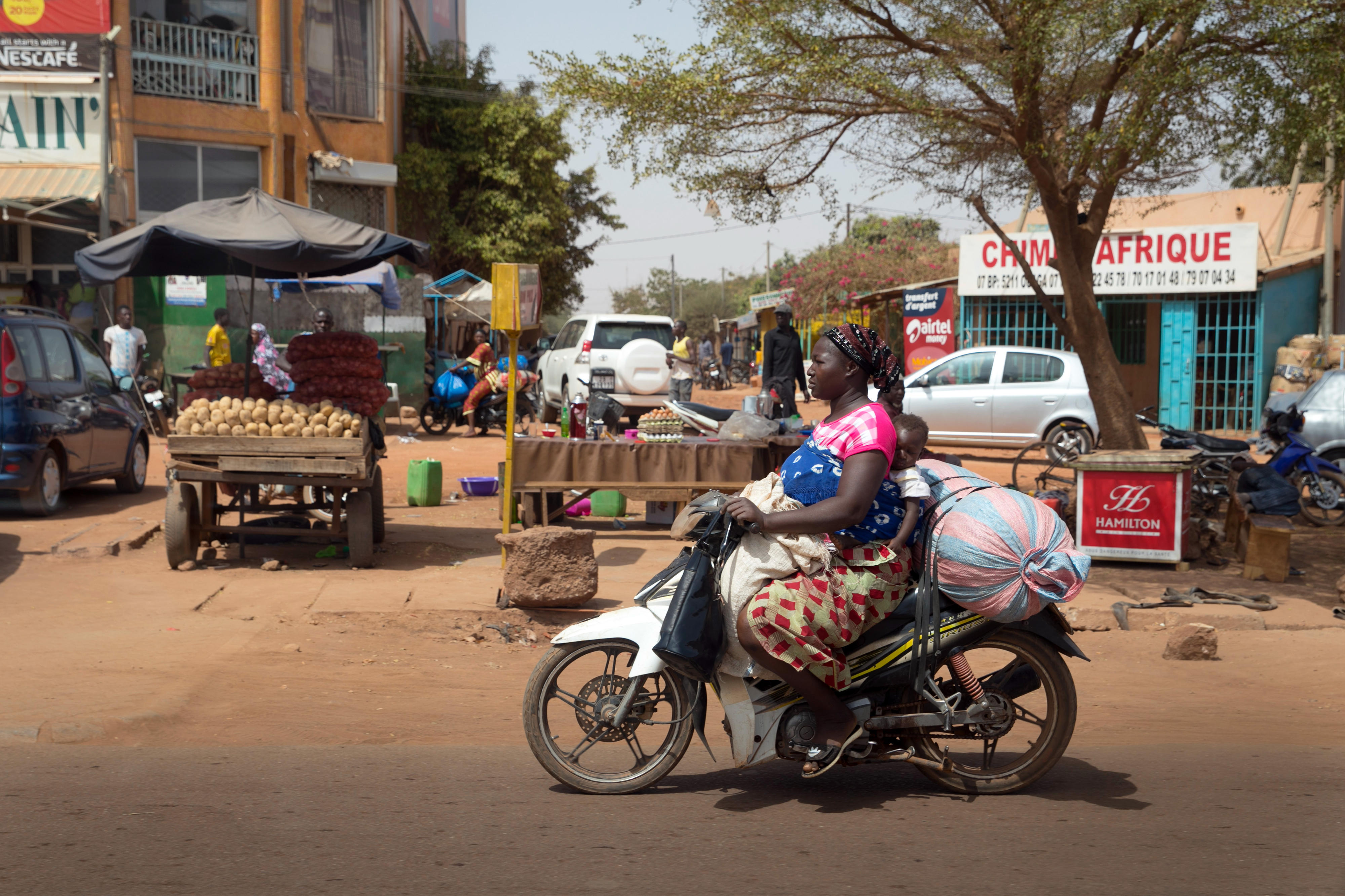 Woman on a scooter in Ouagadougou