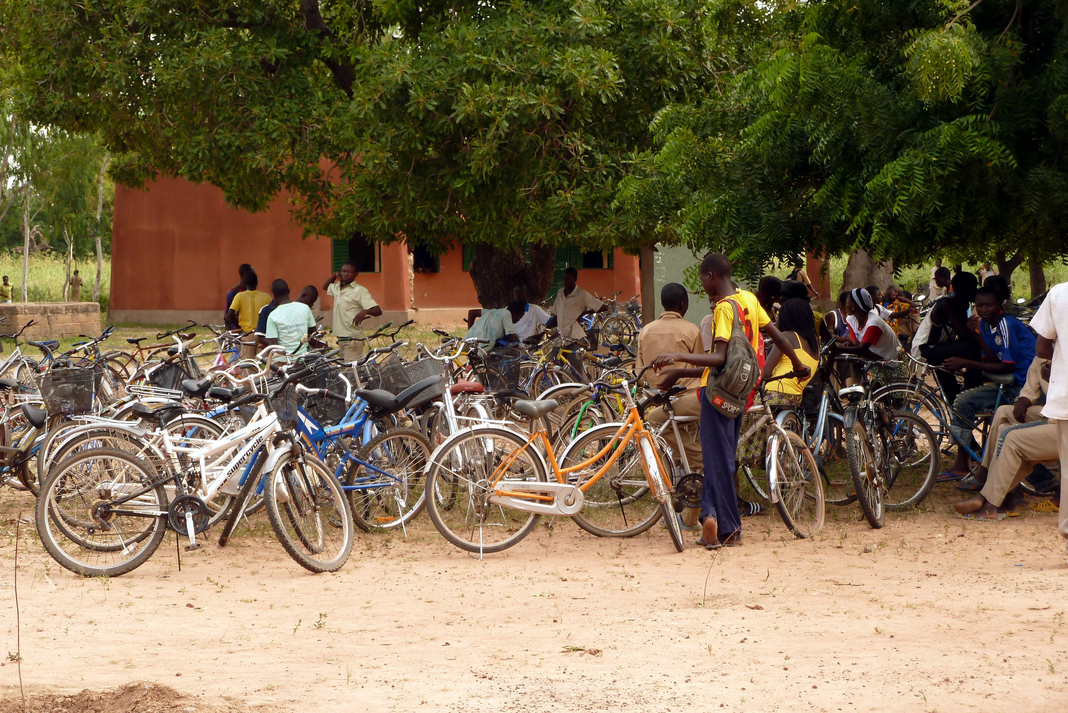 Young people with their bikes on a square in Burkina Faso