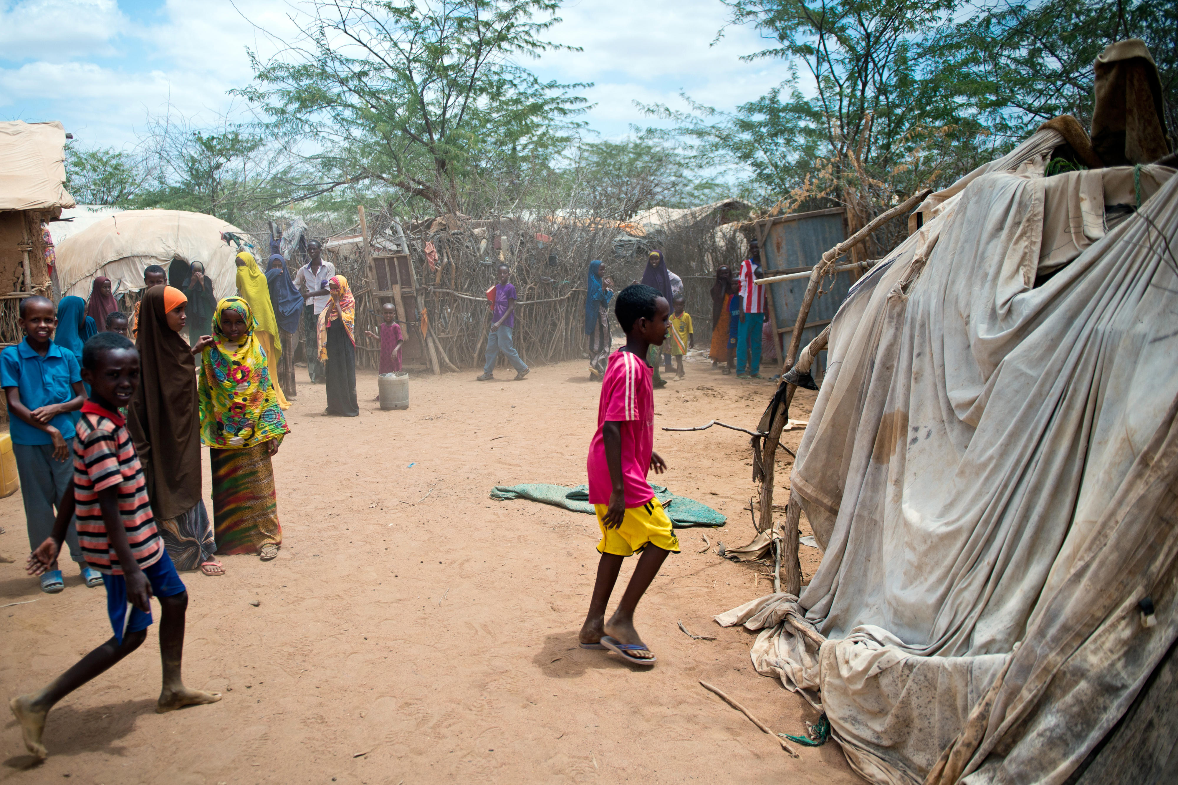 Refugees in front of their huts in Dadaab refugee camp