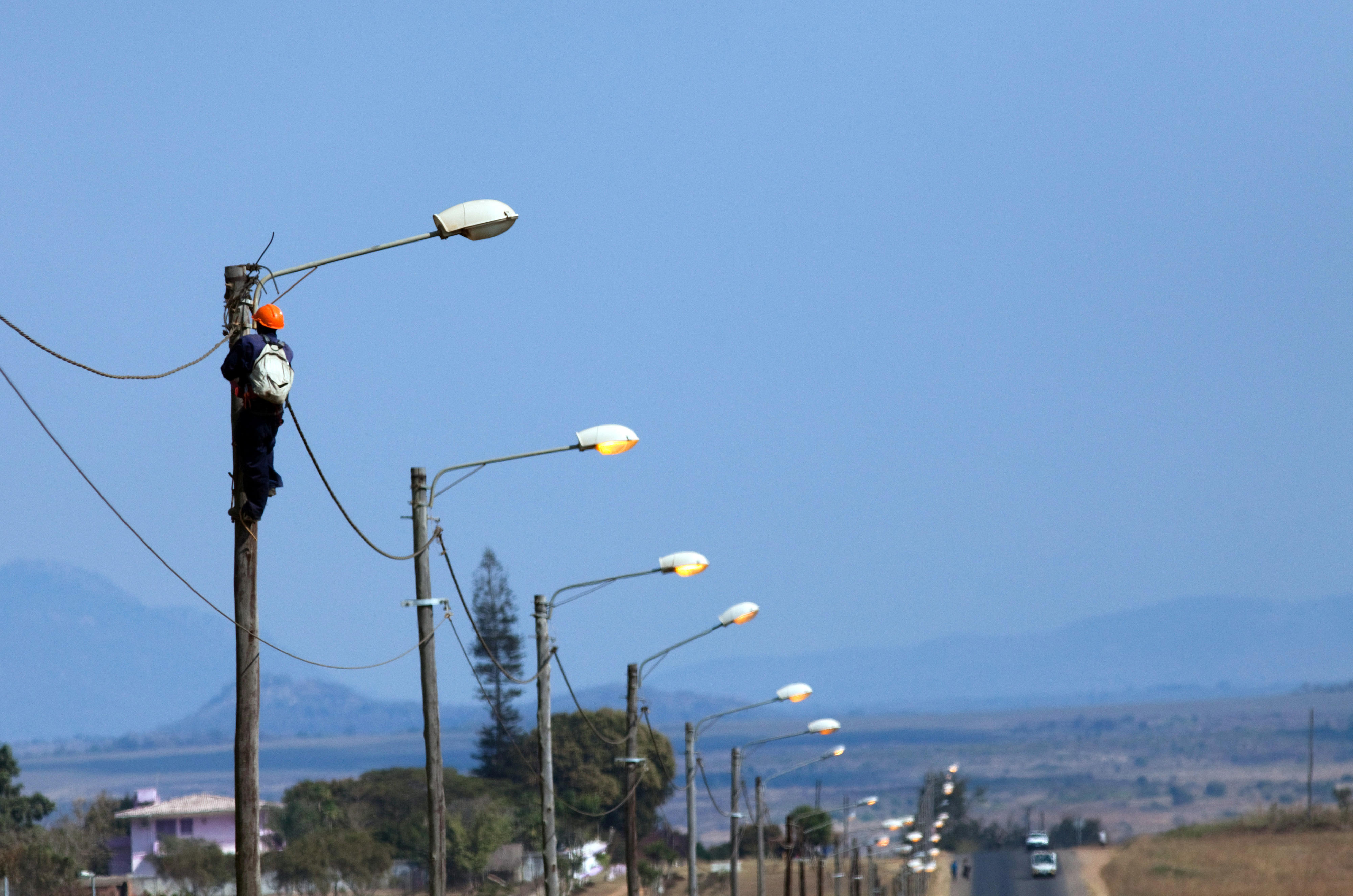 A technician repairs street lighting in Chimoio, Mozambique.