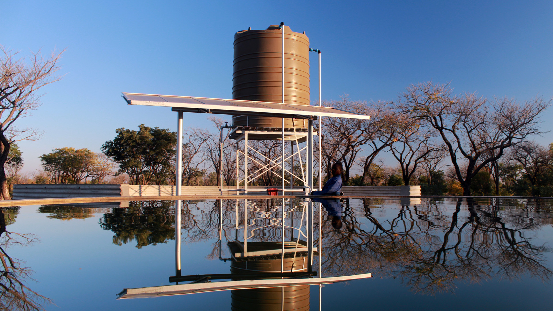 A water storage tank with solar pump installed by the Program for Community Land Development (PCLD)