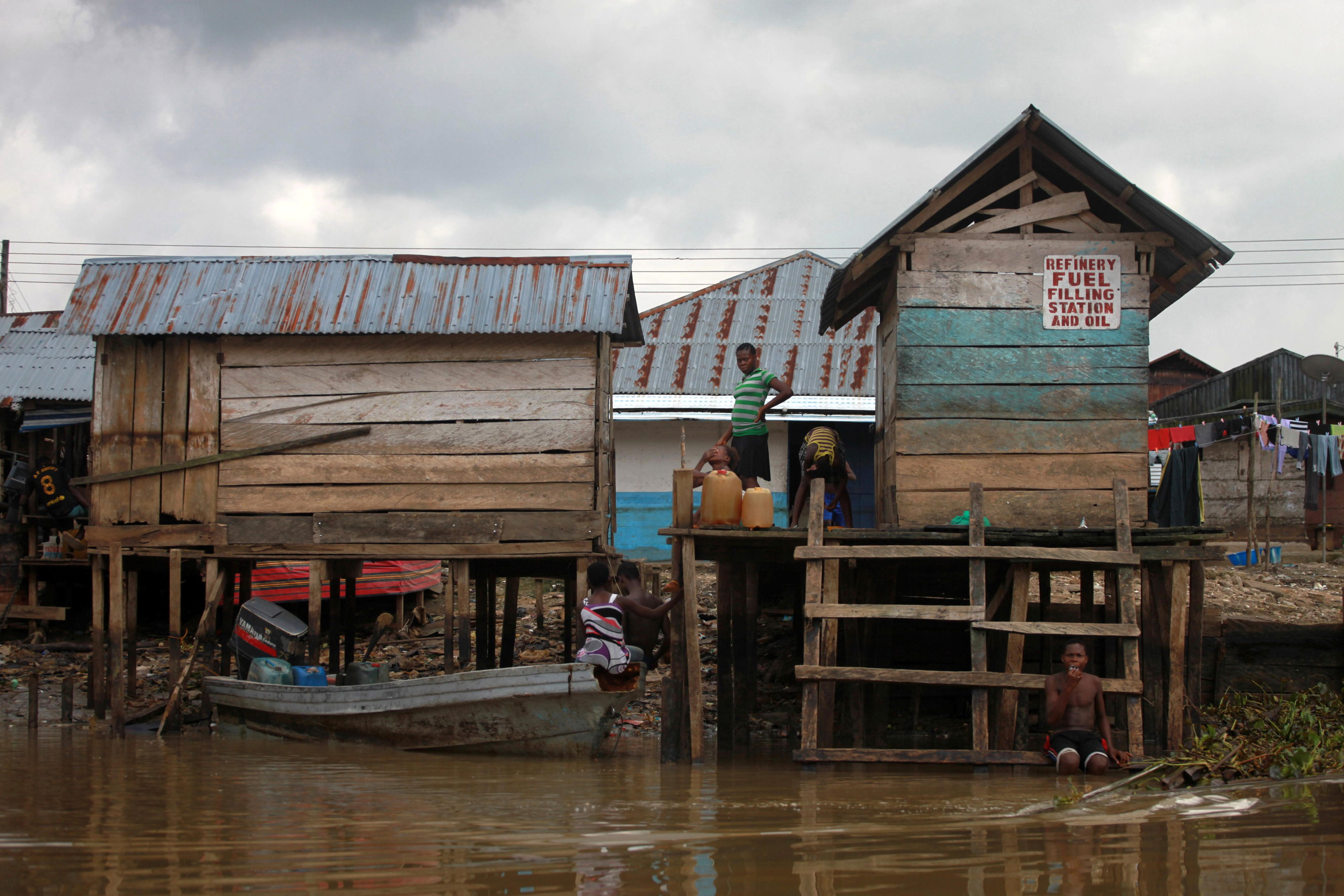 Oil and fuel vendors in a village in the Niger delta