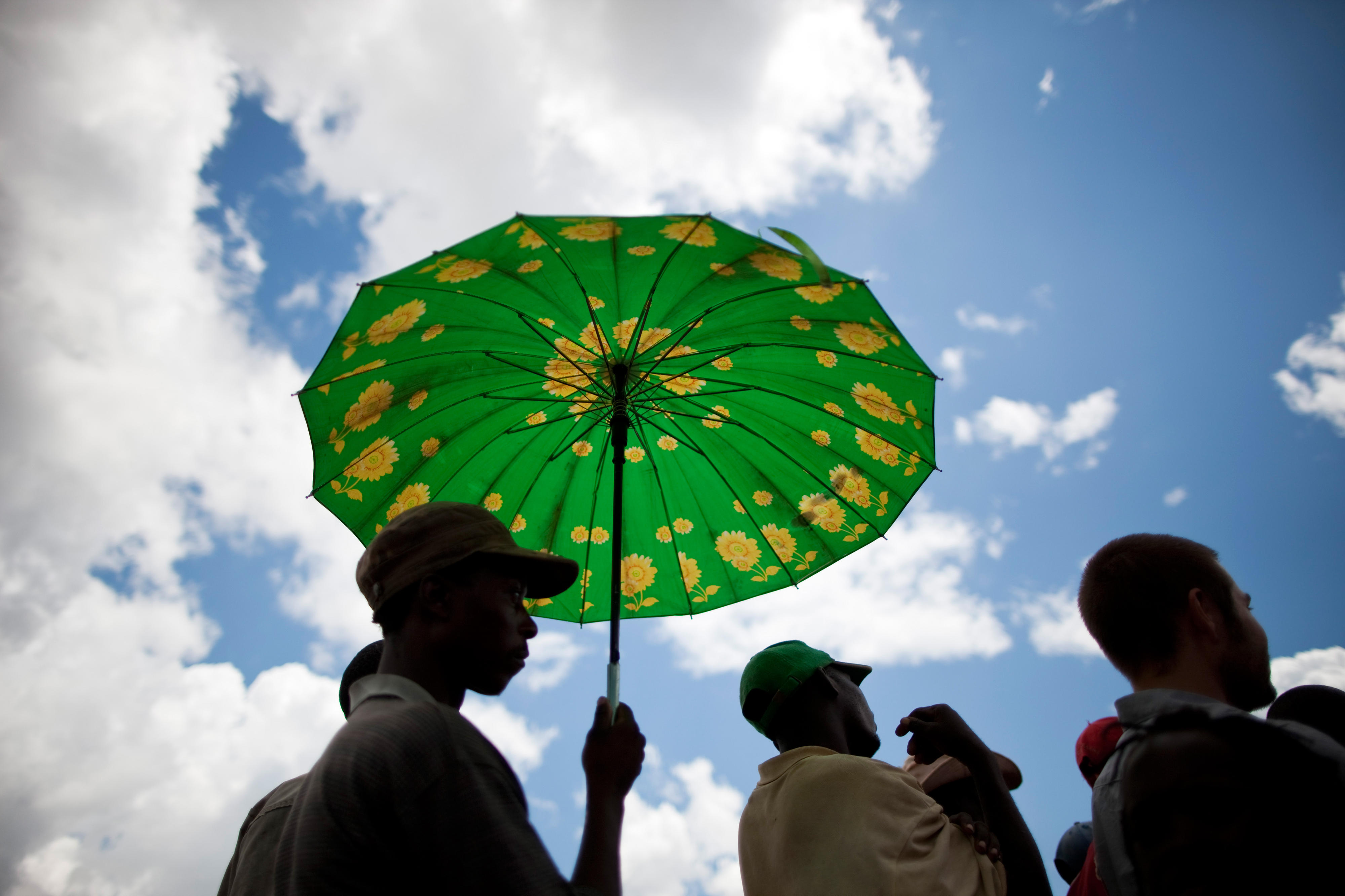 Zambian with parasol in Livingstone