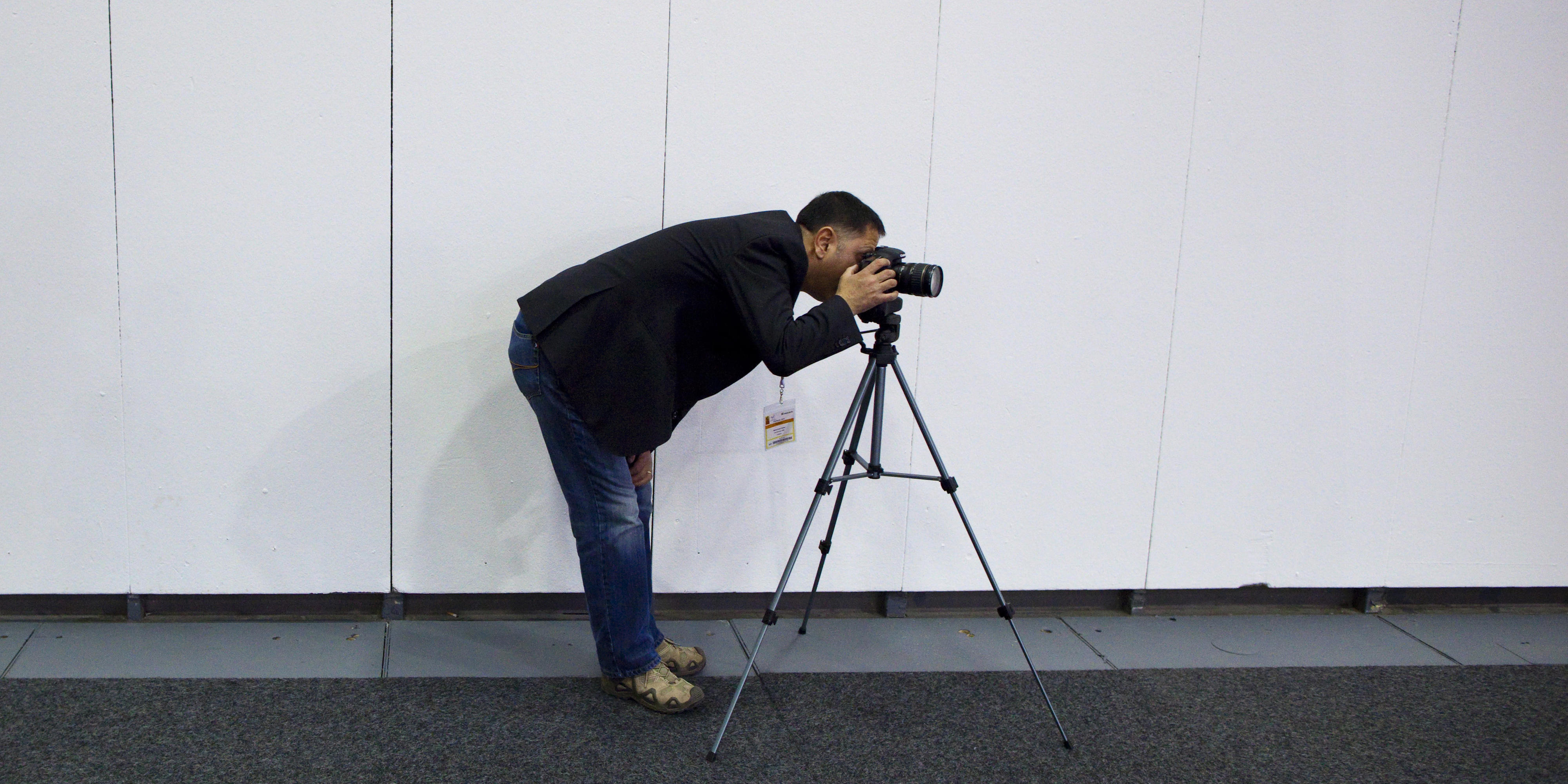 Photographer with camera and tripod