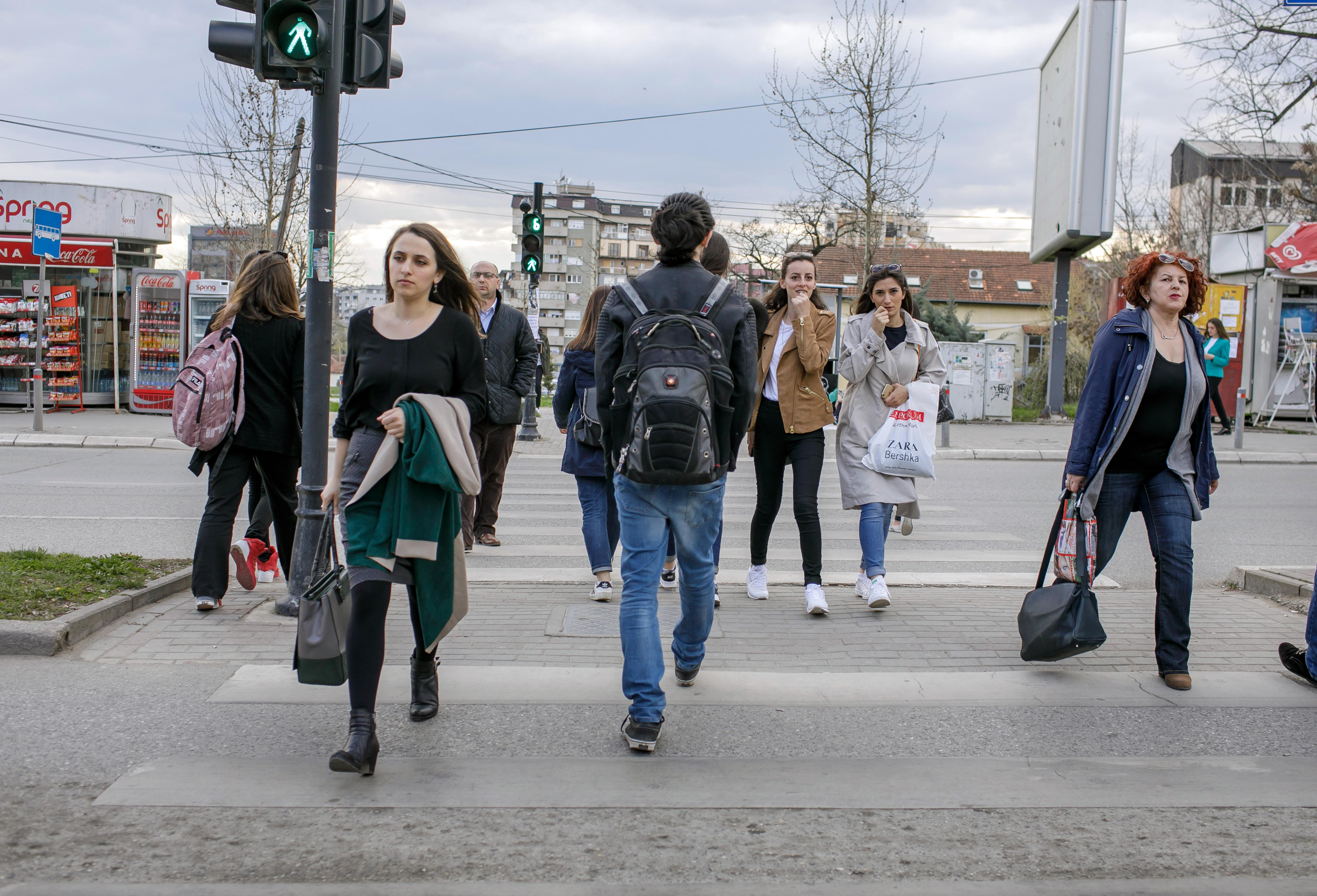 Young people at at traffic light in Pristina, Kosovo