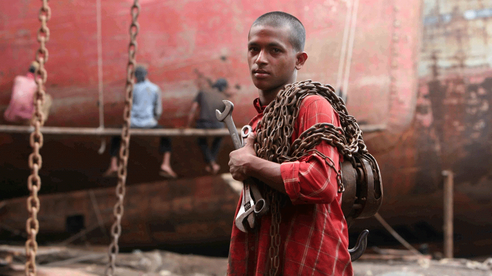 A young worker at the port of Dhaka in Bangladesh