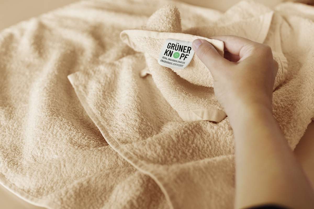 Towel with the Green Button label