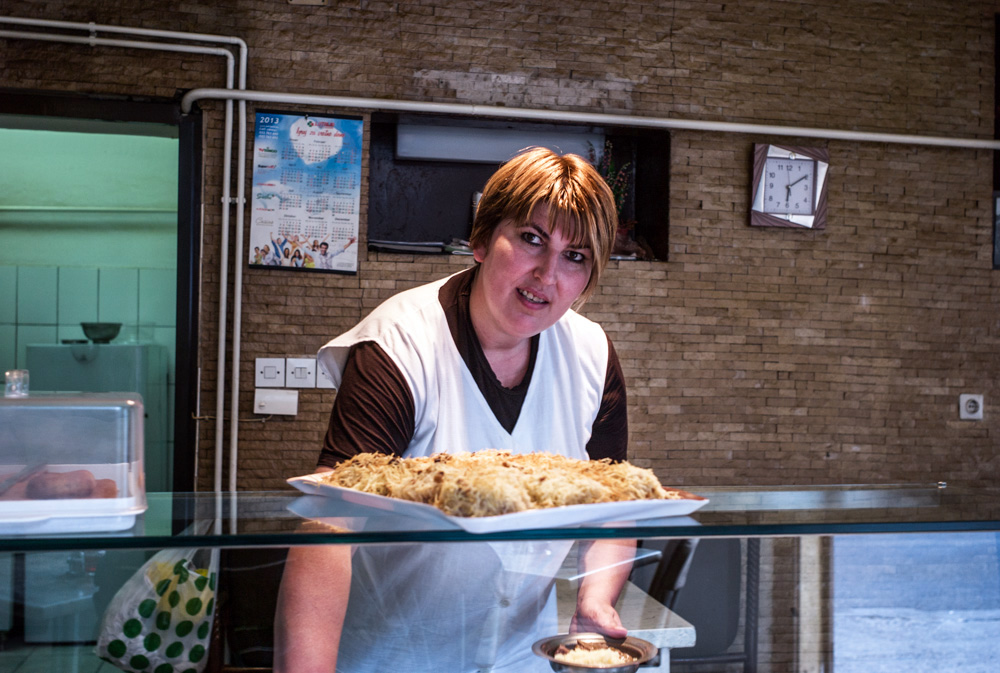 A saleswoman in a snack bar